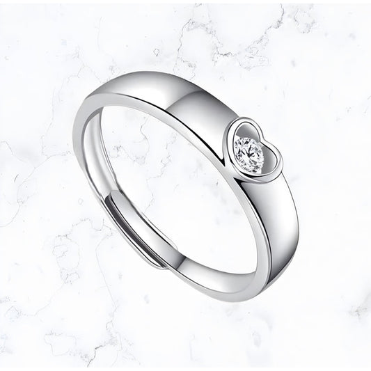 A Silver Band Heart Sparkle Ring with a heart-shaped diamond, perfect for women from Gemineye Jewellery.