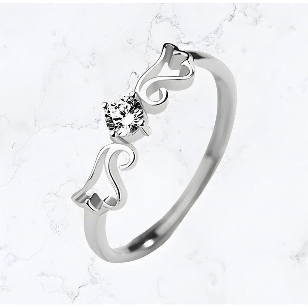 A Silver Angel Wing Sparkle Ring from Gemineye Jewellery with a diamond in the center is an elegant and timeless piece of jewelry.